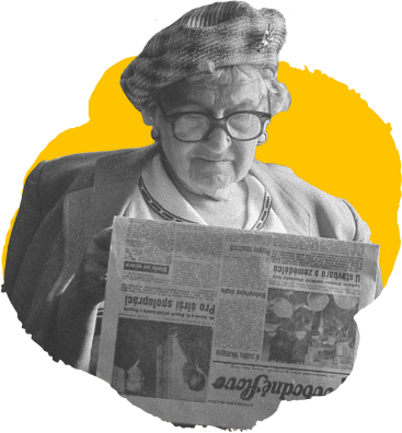 elderly woman reading newspaper