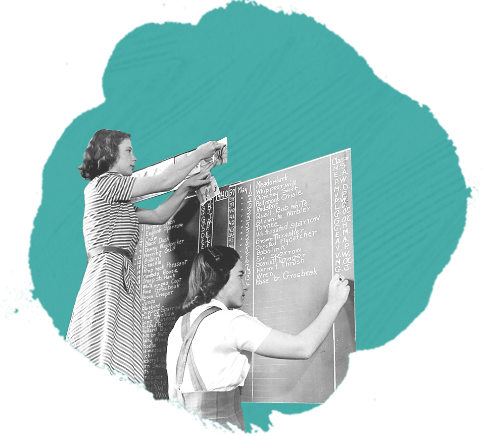 two women writing on chalkboard