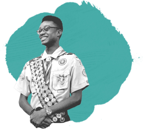 boyscout with sash full of medals
