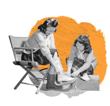 two women trying on ice skates